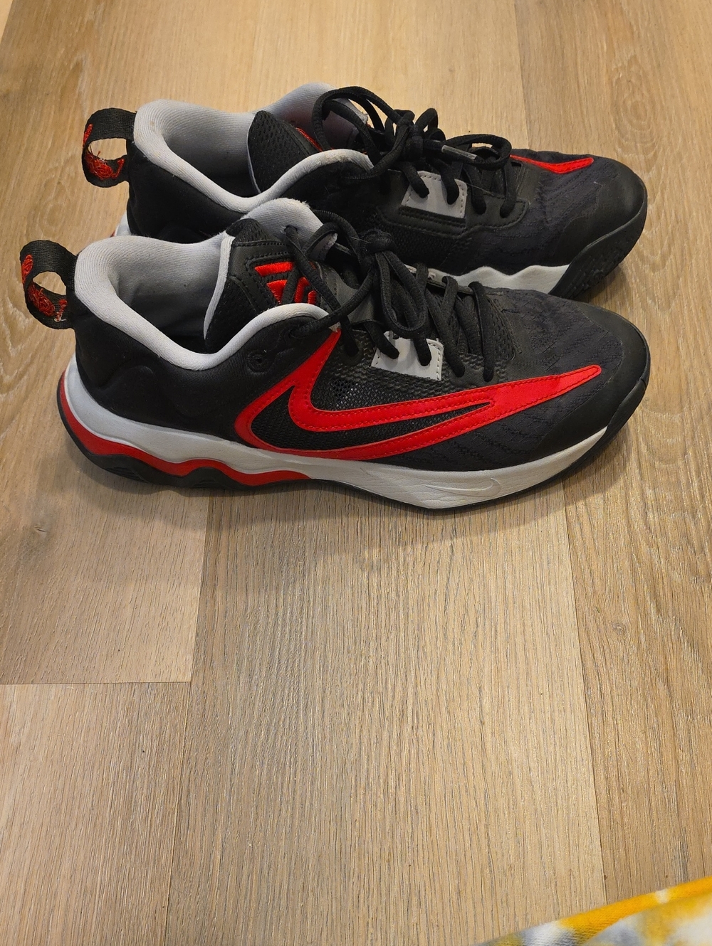 Nike Black Sneakers with Red Swoosh and White Midsoles